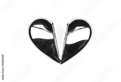 broken metal heart isolated on white background