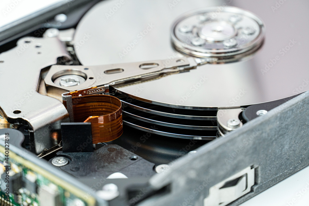 Open hard disk drive close up. Information, cloud data storage, infrastructure cost concept Open hard disk drive close up. Information, cloud data storage, infrastructure cost concept