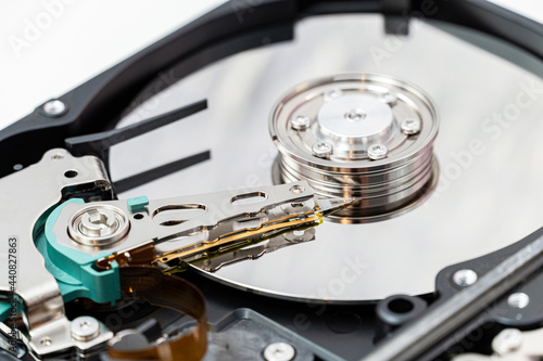 Open hard disk drive close up. Information, cloud data storage, infrastructure cost concept