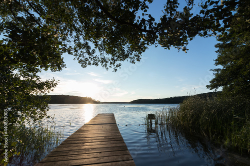 Fototapeta Naklejka Na Ścianę i Meble -  Scenic lakeside with jetty and marvellous bathing area in summer.