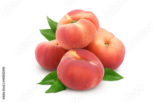 Ripe chinese flat peach fruit with leaf isolated on white background with clipping path and full depth of field
