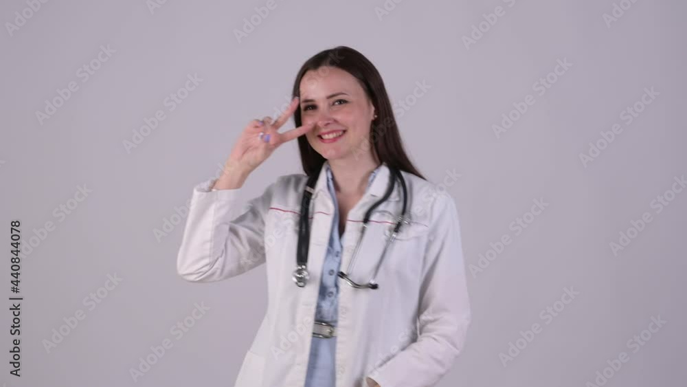 Funny female doctor Smiling and dancing has success and luck at work isolated on white studio background. Medical workers. Funny female doctor Smiling and dancing has success and luck at work isolated on white studio background. Medical workers.