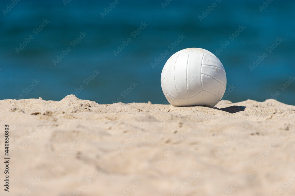 Beach volleyball ball on the sand beach. Team sport concept