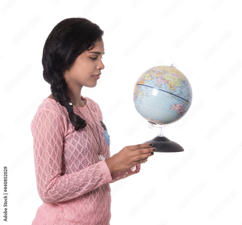 Beautiful Girl holding a world globe isolated on a white background Beautiful Girl holding a world globe isolated on a white background