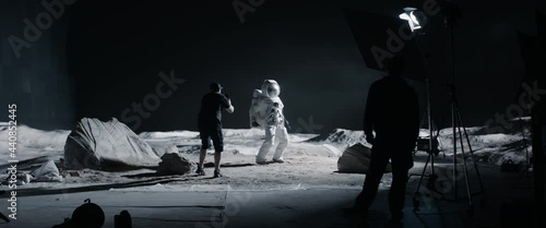 WIDE Behind the scenes, cinematographer shooting viral video for social account on a large Moon landing set. Virtual production with LED screens. Shot with 2x anamorphic lens photo