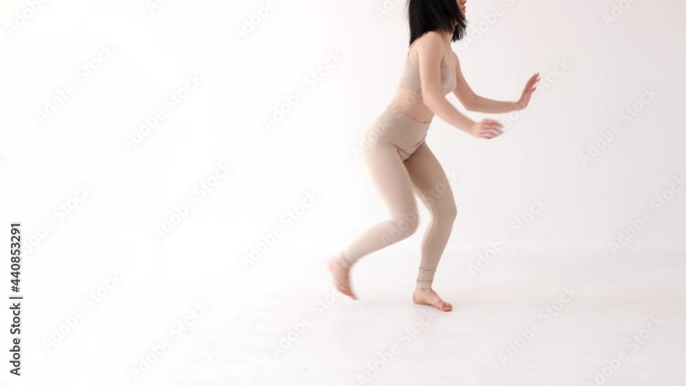 Woman in beige costume dancing contemp on white background Woman in beige costume dancing contemp on white background