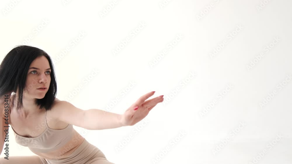 Woman in beige costume dancing contemp on white background Woman in beige costume dancing contemp on white background