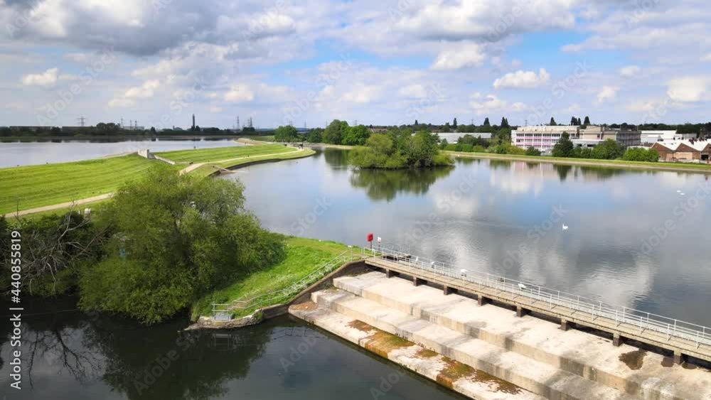 water reservoir system in Walthamstow Wetlands. Calm water surface reflecting sky with clouds water reservoir system in Walthamstow Wetlands. Calm water surface reflecting sky with clouds