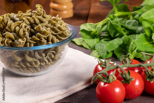 Raw spinach screw noodles, vegetarian, vegan . Healthy food