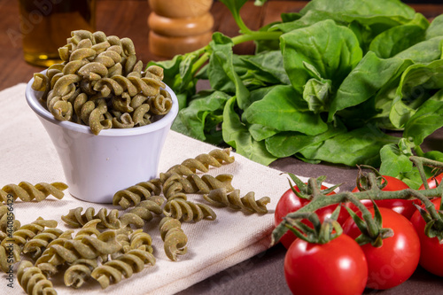 Raw spinach screw noodles, vegetarian, vegan . Healthy food