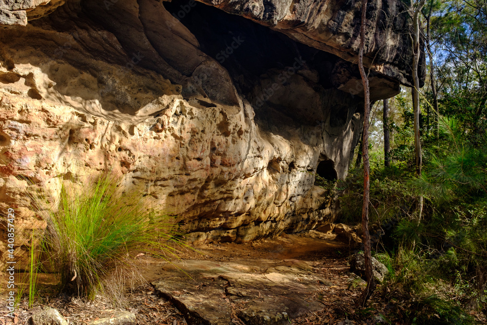 Overhanging sandstone rock shelter on Bomaderry Creek Gorge walking trail, Bomadarry, Nowra, NSW Australia Overhanging sandstone rock shelter on Bomaderry Creek Gorge walking trail, Bomadarry, Nowra, NSW Australia