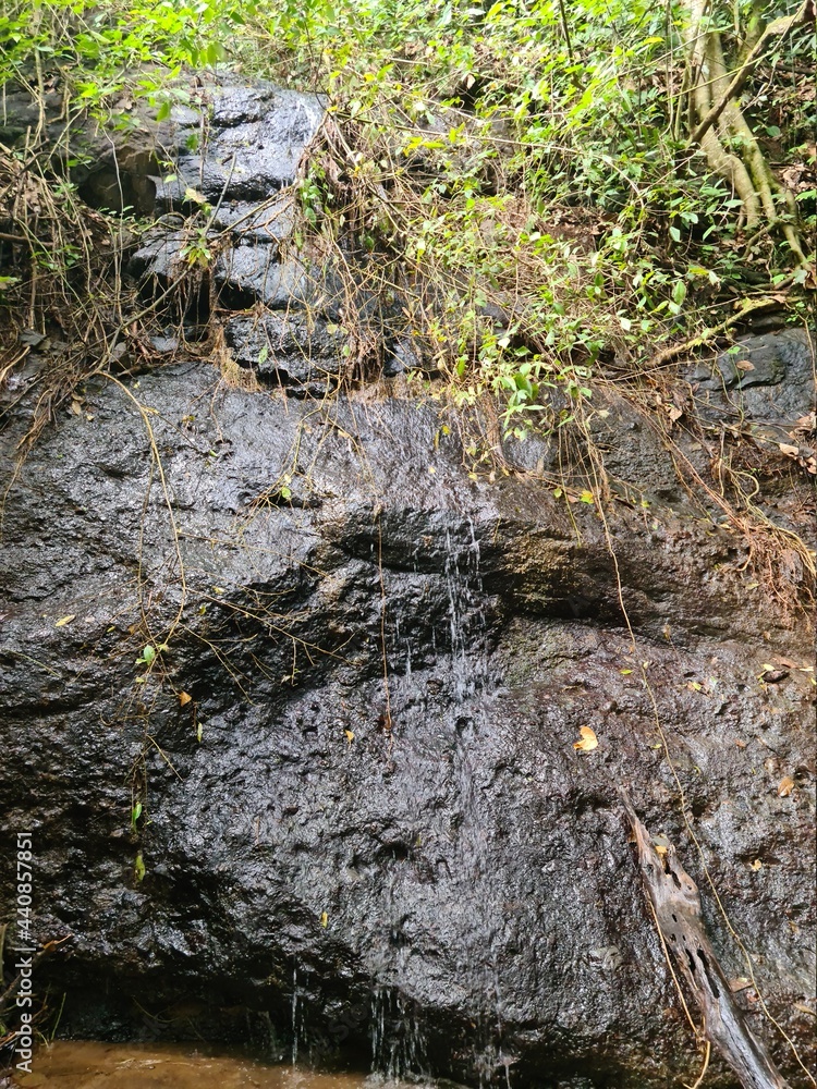 Small waterfall background and texture in the forest. Small waterfall background and texture in the forest.
