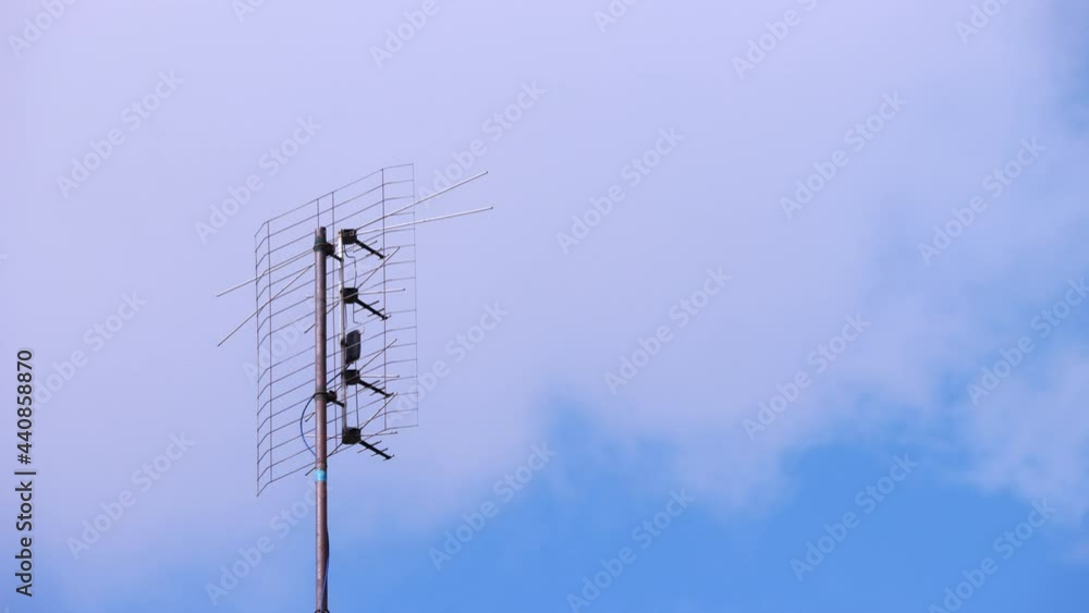 TV antenna in the background of clouds - time lapse footage. TV antenna in the background of clouds - time lapse footage.