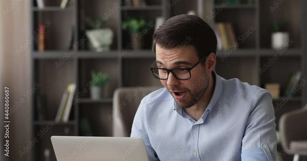 Cheery man celebrate unbelievable notice read on laptop. Career advance, salary growth, commercial special offer happy client, bank mortgage accepted, great news candid emotion, moment of win concept Cheery man celebrate unbelievable notice read on laptop. Career advance, salary growth, commercial special offer happy client, bank mortgage accepted, great news candid emotion, moment of win concept
