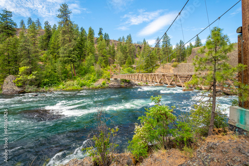The wooden suspension bridge over the Spokane River at the Bowl and Pitcher area of Riverside State Park in Spokane, Washington, USA