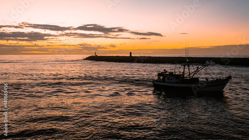 fish boat on sunrise  © Guilherme