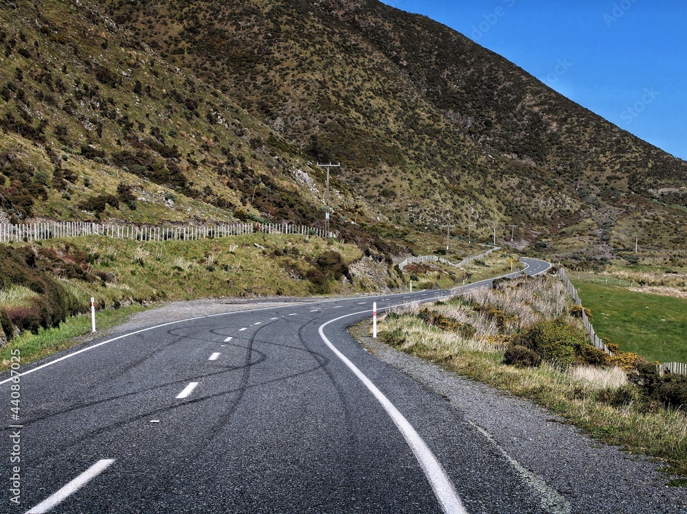 Fototapeta premium Windy Road to sea with tire marks