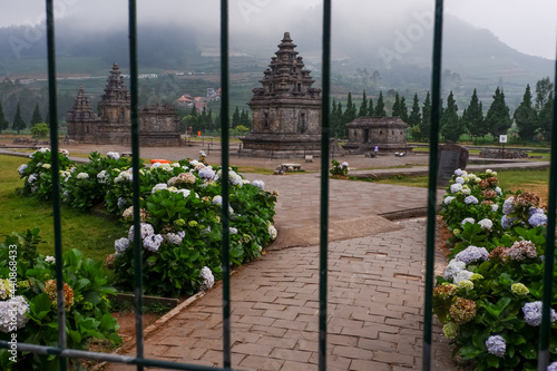 Beautiful view of the Dieng temple compound behind the gate in Indonesia photo