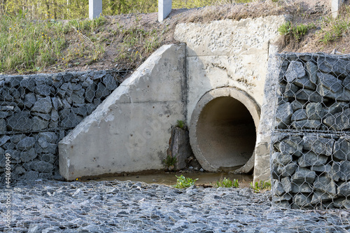 Street outdoor sewerage, concrete pipe. Sewer drains photo