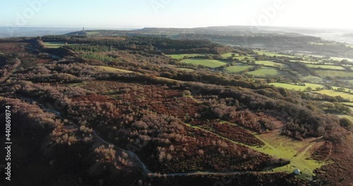 4K Aerial smooth right pan over the amazing rolling hills of Culmstock Beacon in the Blackdown Hills of Devon England photo