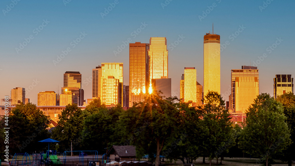 Fototapeta premium The skylines of downtown Minneapolis under golden hour