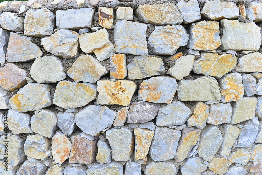 Fototapeta premium Brick and stone walls, red leaves