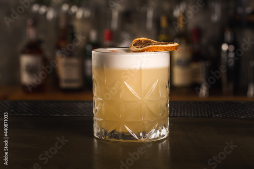 Whiskey Sour drink in a bar environment
