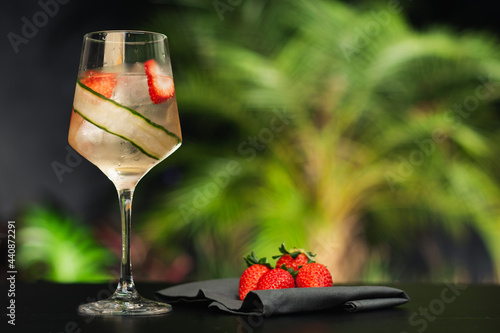 refreshing bar drink Lillet Vive made with strawberry, cucumber and ice