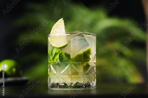 Brazilian caipirinha drink with cachaça, lemon, sugar and ice