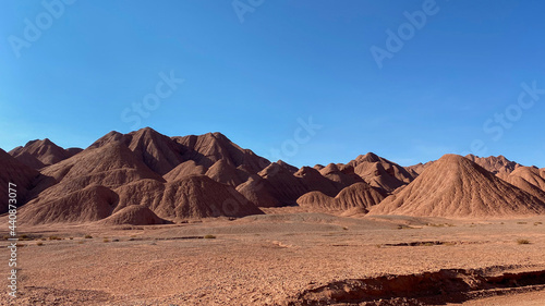Panoramic view of red mountains and blue sky. Rocky Mountains. tourist banner design