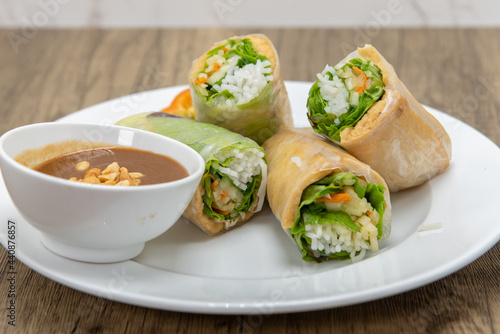 Hearty plate of tofu spring rolls cut in halves for a complete meal