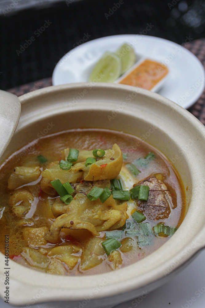 delicious beef tendon curry cooked with coconut milk soup, served with chili sauce delicious beef tendon curry cooked with coconut milk soup, served with chili sauce