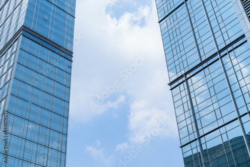 Chengdu cityscape low angle view of modern office building with clouds blue sky 