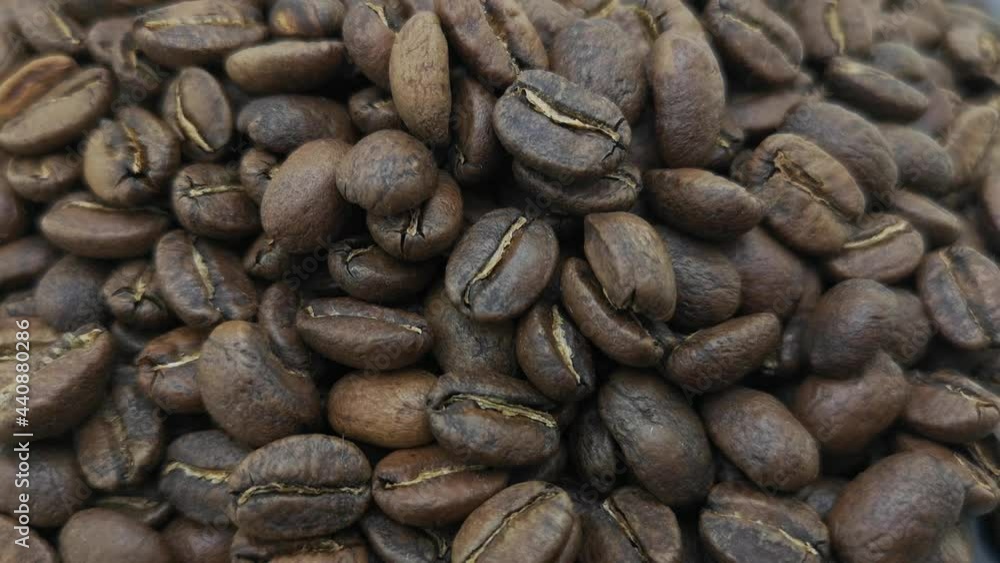 Roasted coffee beans close up background coffee from colombia Roasted coffee beans close up background coffee from colombia
