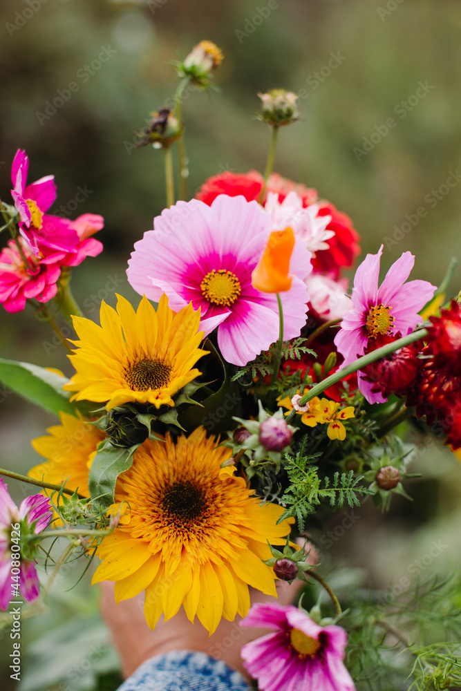 Bouquet of wildflowers held in a hand on a farm Bouquet of wildflowers held in a hand on a farm