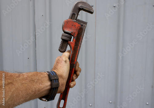 Worker With a Pipe Wrench