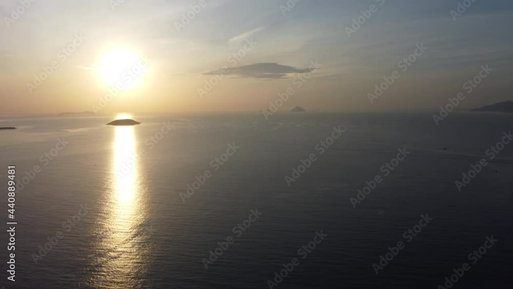 Drone flying over the tropical sea during sunrise in Vietnam Drone flying over the tropical sea during sunrise in Vietnam