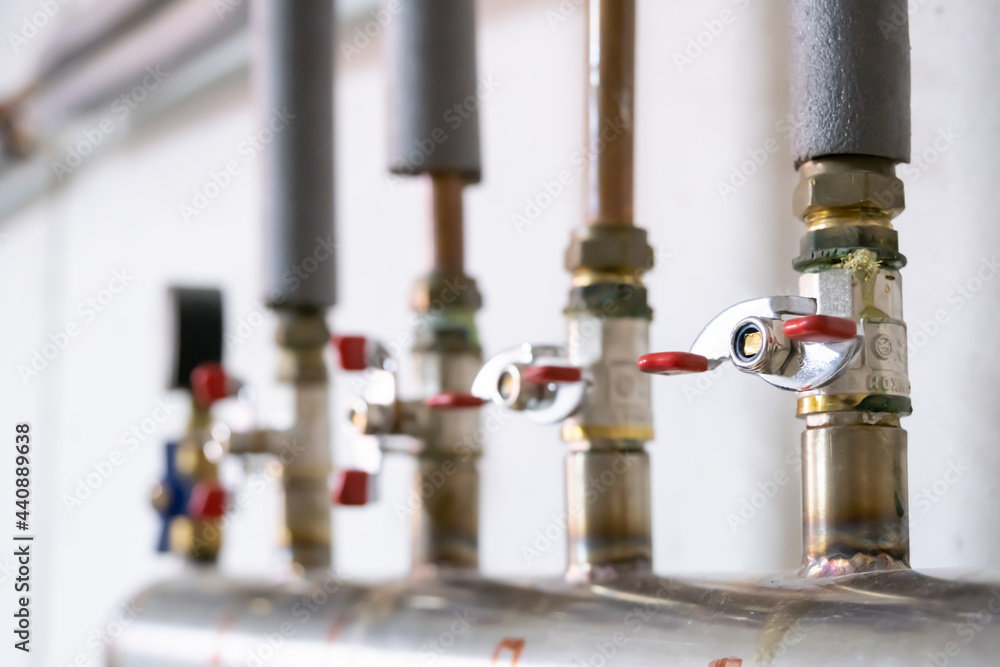 Regulator on pipes. Switch, water switch. A handle that blocks the water in the pipes. Regulator on pipes. Switch, water switch. A handle that blocks the water in the pipes.