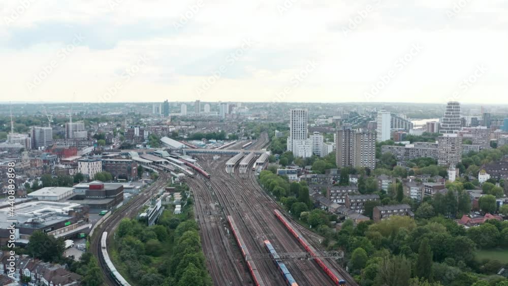 slow dolly forward drone shot of busy London Clapham Junction train station slow dolly forward drone shot of busy London Clapham Junction train station