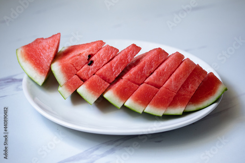 fresh watermelon slices in a white plate