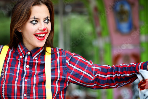 Cute girl in a clown makeup