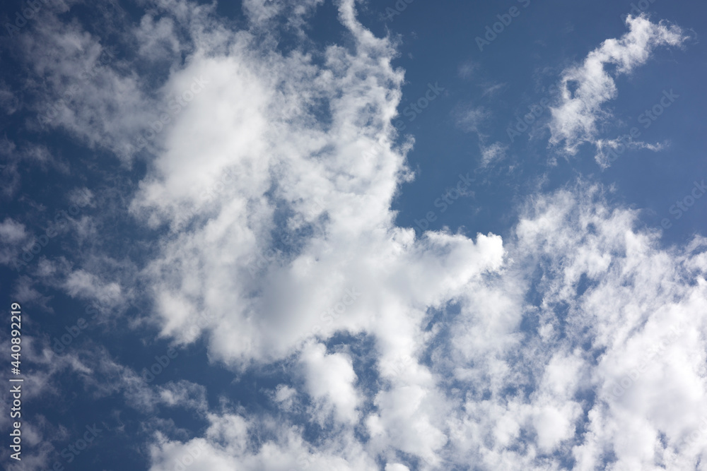Bright blue sky background texture with fluffy clouds Bright blue sky background texture with fluffy clouds