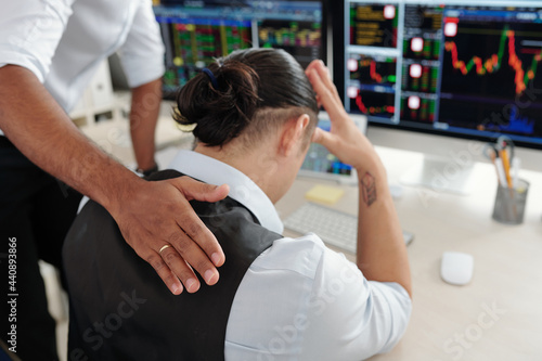 Tableau sur toile Trader patting sad desperate collegue on back reassuring him after he made bad i
