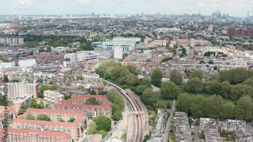 Drone shot over district line underground trains towards Stamford Bridge chelsea stadium London photo