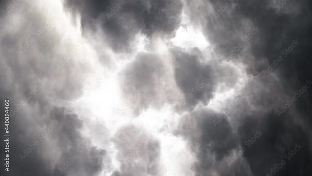 flying through heavy thunderstorm clouds, lightning bolts strike ahead. flying through heavy thunderstorm clouds, lightning bolts strike ahead.