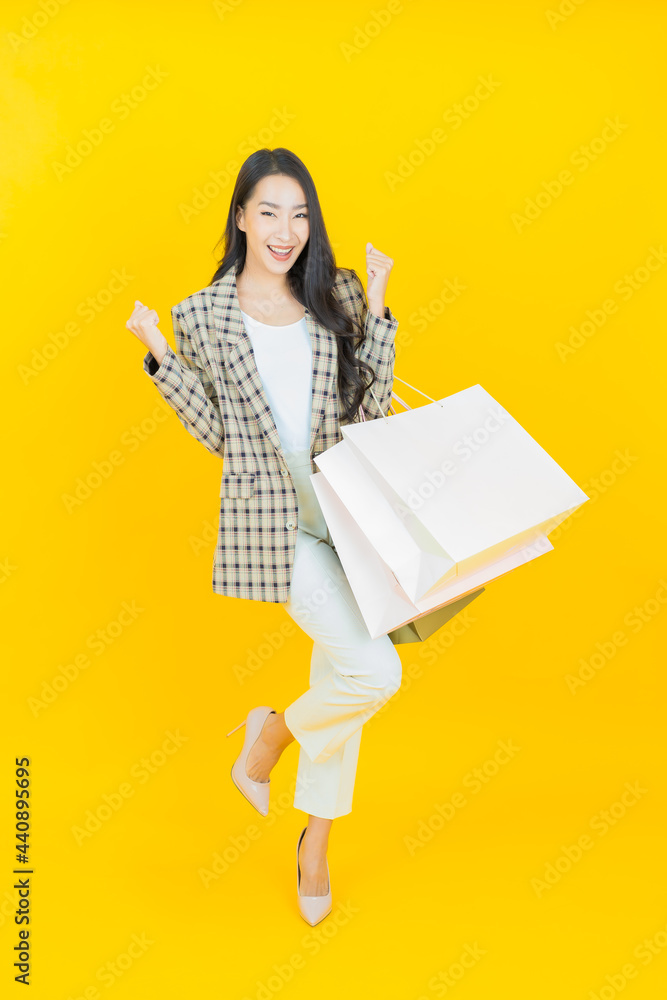 Portrait beautiful young asian woman smile with shopping bag Portrait beautiful young asian woman smile with shopping bag
