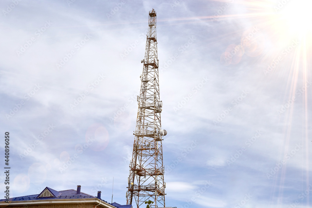 Urban Metal Cellular Antenna, a tower for transmitting Television and Cellular signals Urban Metal Cellular Antenna, a tower for transmitting Television and Cellular signals
