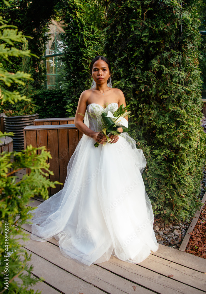 Beautiful asian vietnamese bride in white dress indoors