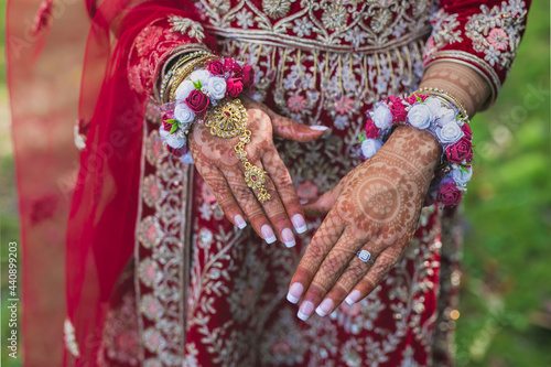 Indian bride's wedding outfit, jewellery, henna mehendi mehndi hands close up