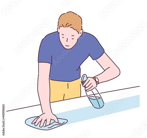 A man is spraying detergent and wiping the desk. hand drawn style vector design illustrations. 